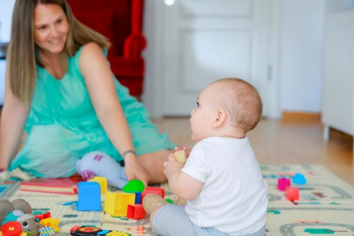 interact and play with the baby